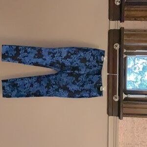 These Banana Republic pants are black with a blue floral pattern